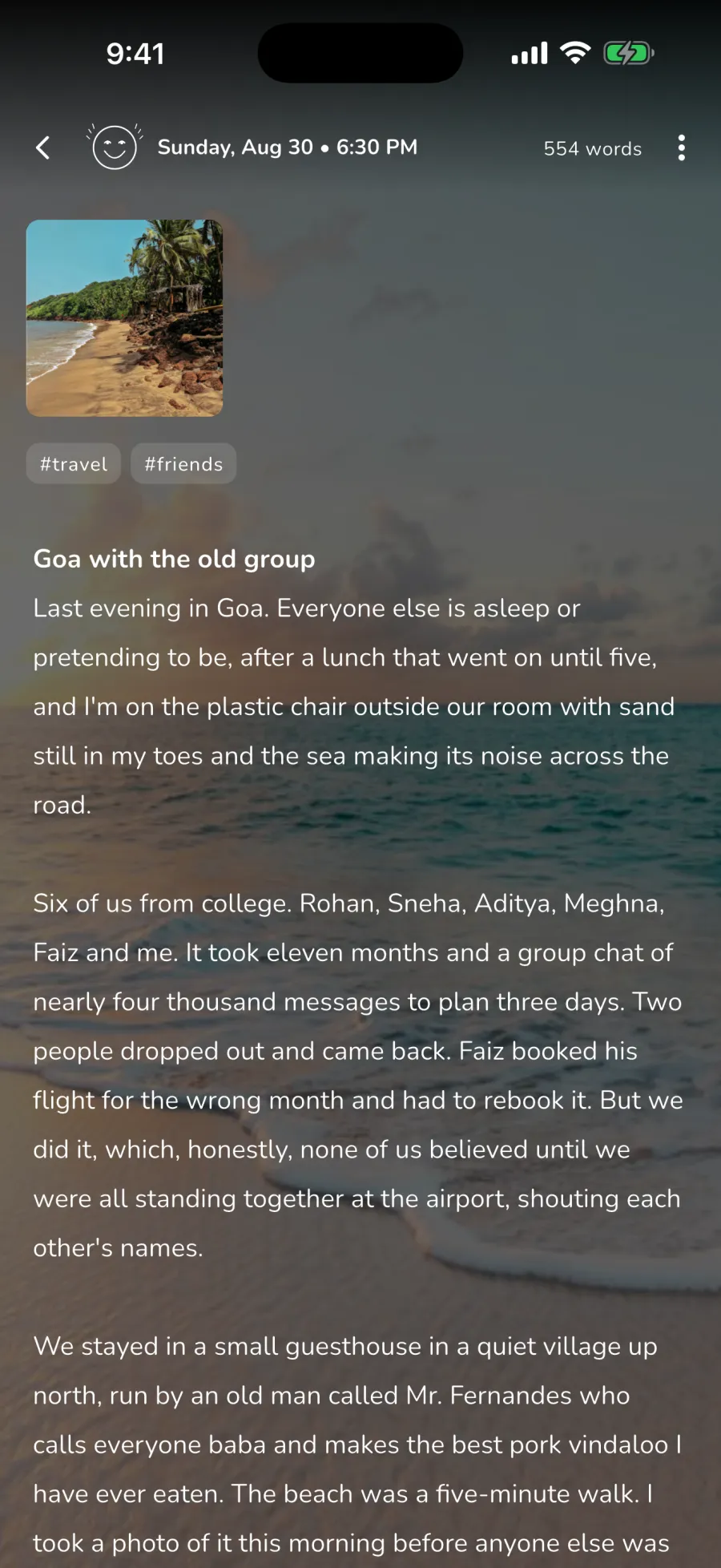 A WOYM journal entry written over a photo of a beach